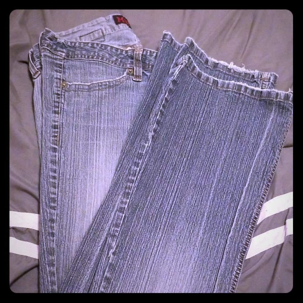 Mud boot-cut distressed jeans